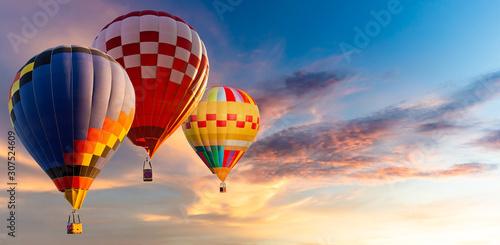 Beautiful landscape hot air balloons flying over sky at sunset
