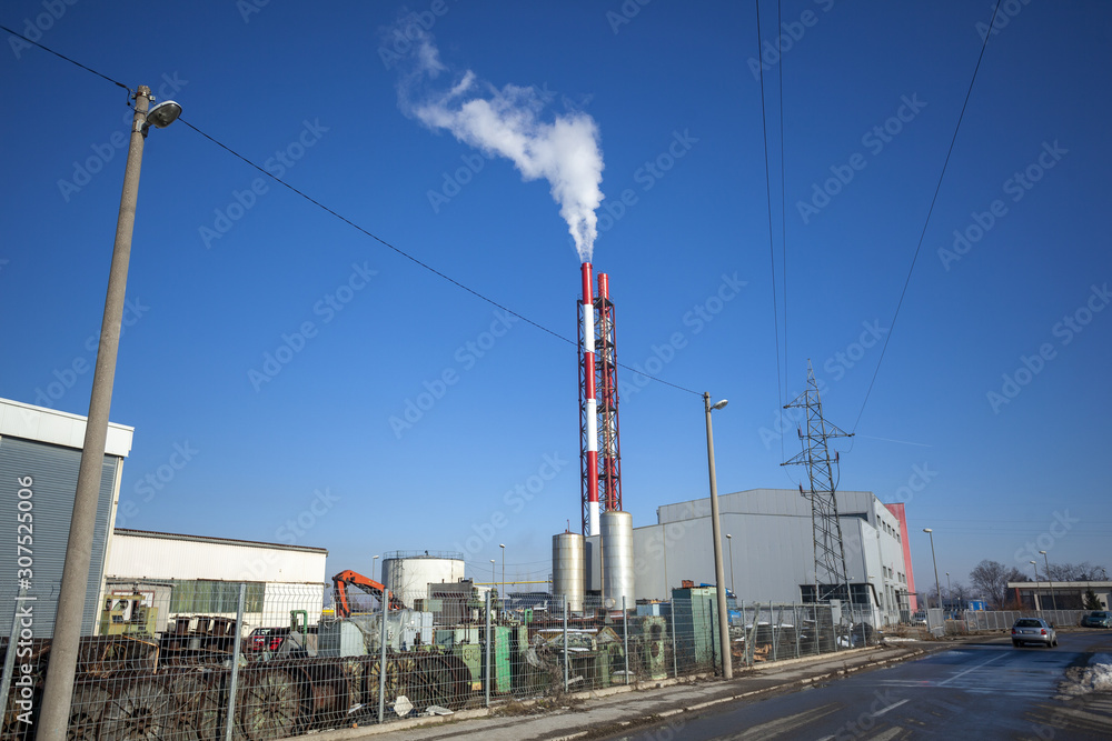 Heating plant - powerhouse and chimey with smoke Heating plant - powerhouse and chimey with smoke