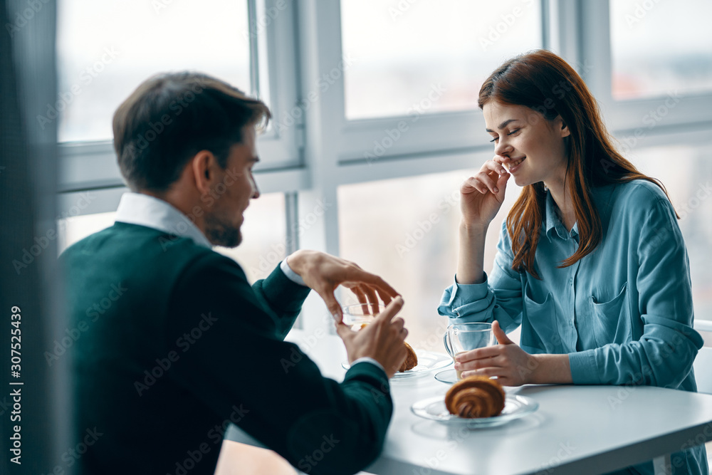 man and woman talking on cell phone man and woman talking on cell phone