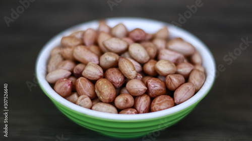 Peanuts or groundnut on wood background.