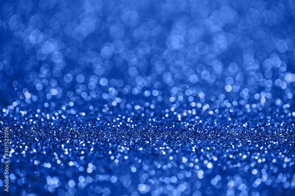 color of the year 2020, classic blue, shinig sparkles bokeh background.