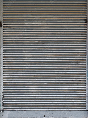 Old weathered steel roller shutter door