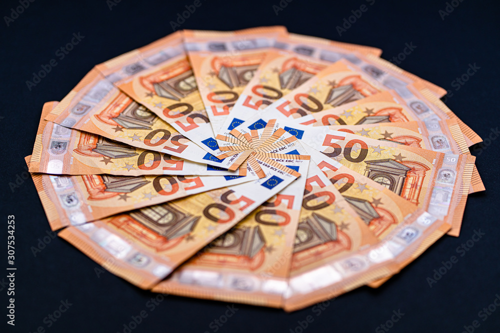 Euro cash money in notes. Studio shot isolated on black background. High fifty paper notes only. European currency. Euro cash money in notes. Studio shot isolated on black background. High fifty paper notes only. European currency.