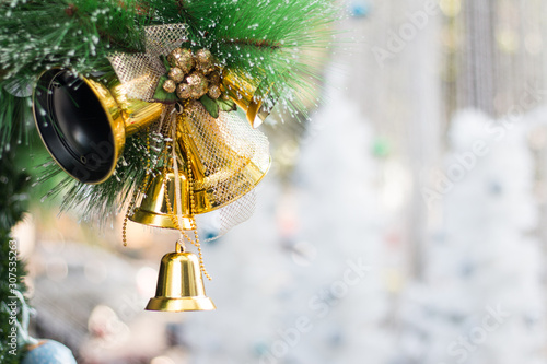 Xmas or Christmas bauble hanging at fir branch.