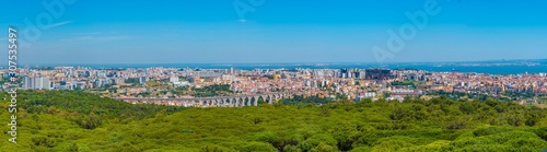 Aerial view of Lisbon dominated by an ancient aqueduct, Portugal photo