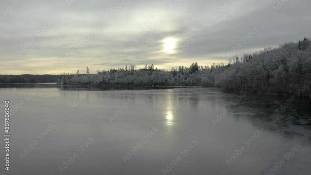 Crispy cold morning over a frosty lake Crispy cold morning over a frosty lake