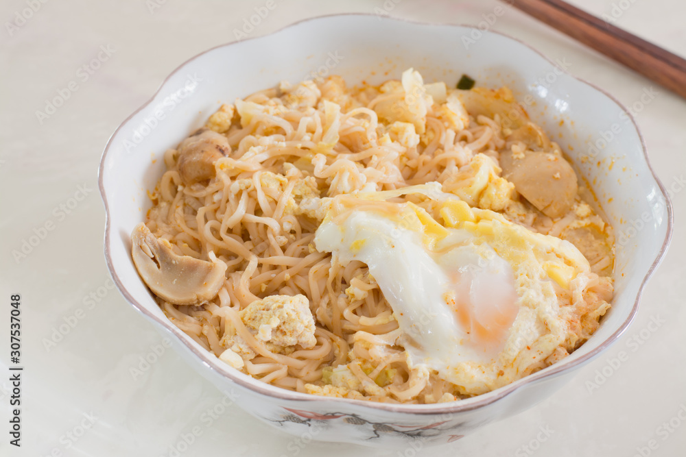 Thai style instant noodle call Mama with egg and meat, cheap food Thai style instant noodle call Mama with egg and meat, cheap food