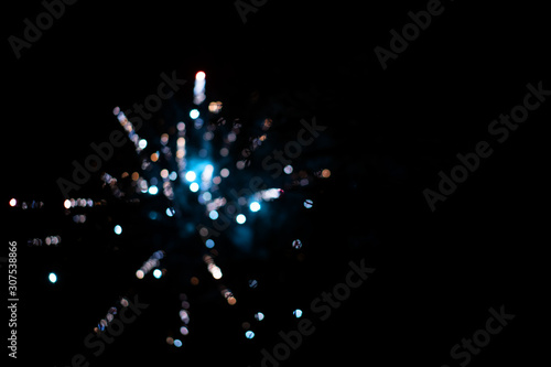 Color fireworks festival. Christmas, new year celebration holiday out of focus background. Dark background.