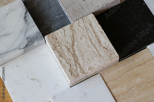 color samples of marble  on oak wood table, stone surface