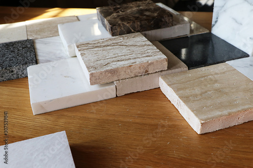Fototapeta Naklejka Na Ścianę i Meble -  color samples of marble  on oak wood table, stone surface