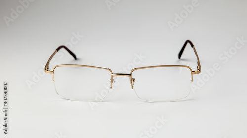 Gold eyeglasses on white background isolate