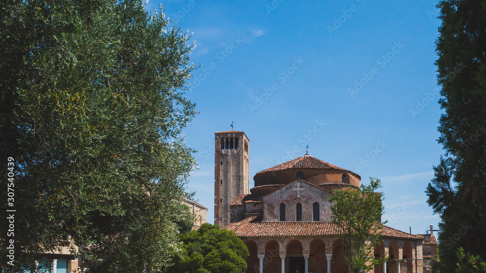Cathedral of Santa Maria Assunta's bell tower and Church of Santa Fosca on island of Torcello, Venice, Italy
