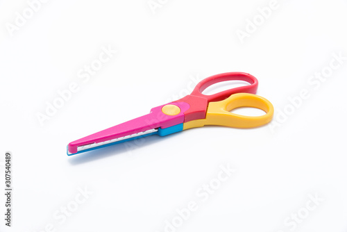 Colorful scissors on white background.