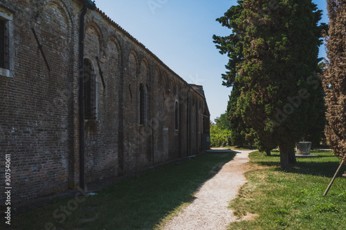 Path by Cathedral of Santa Maria Assunta on island of Torcello, Venice, Italy
