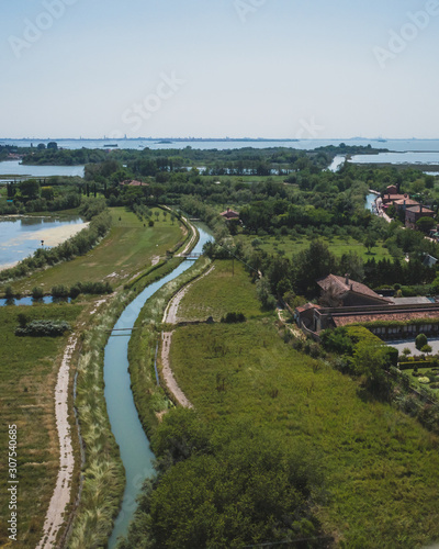 View of island of Torcello and lagoon, from bell tower of Cathedral of Santa Maria Assunta, Torcello, Venice, Italy © Mark Zhu