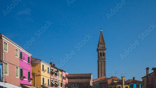 Bell tower over colourful houses on island of Burano, Venice, Italy