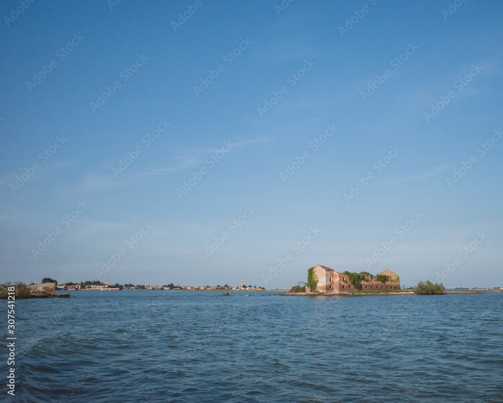 Building ruins on island in lagoon, Venice, Italy