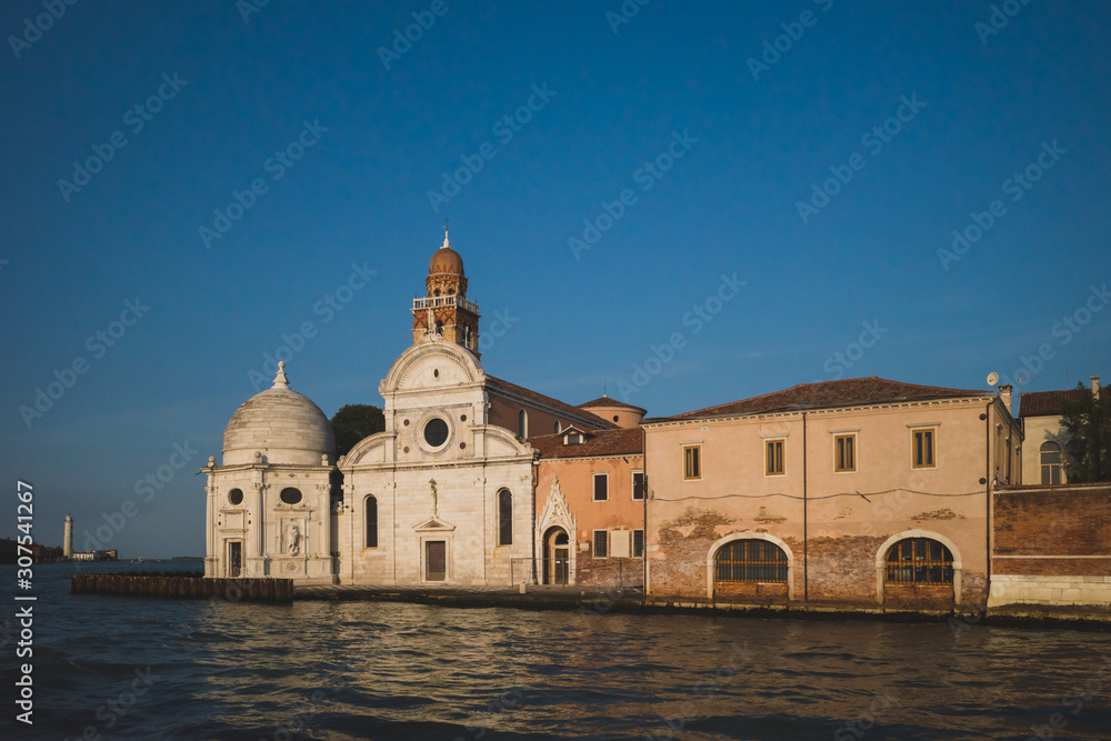 Church on island of San Michele with bell tower at sunset, Venice, Italy