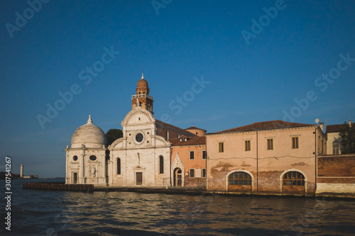 Church on island of San Michele with bell tower at sunset, Venice, Italy