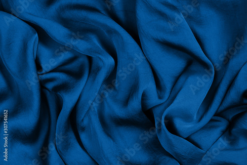 Texture of soft and shiny classic blue silk