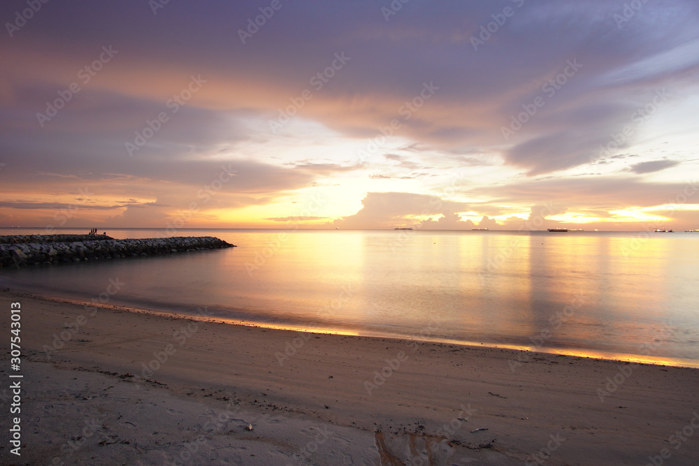Long exposure shot of seascape with dusk sky background.