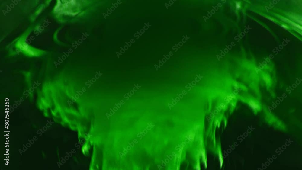 Paint fall into water which is twist. Spin acrylic ink drip into liquid ...