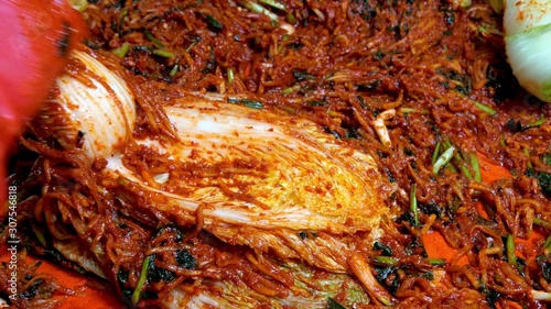 Korean food : BaechuKimchi. BaechuKimchi is a fermented food with salted fish and spices added to vegetables, a unique vegetable salting food developed in Korea and a must at the Korean table. photo