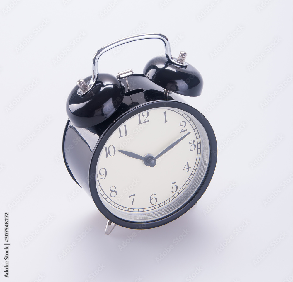 Naklejka premium clock or alarm clock on a background new.