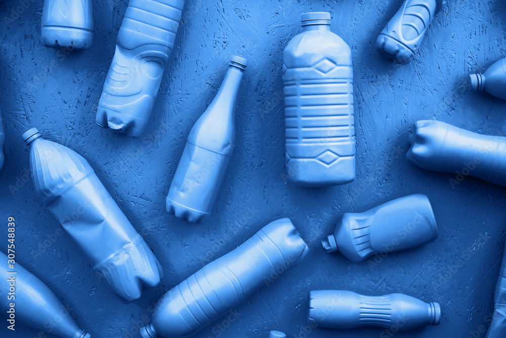 Obraz premium Plastic bottles in blue color. Eco concept. All bottles are in one color.