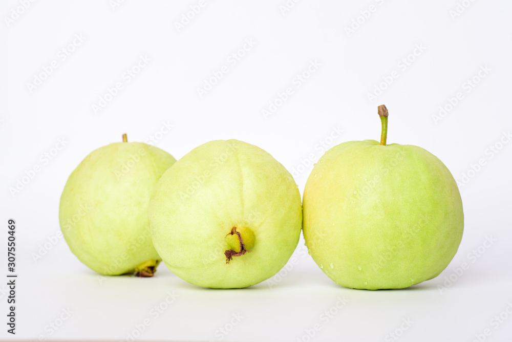 Fresh organic guava tropical fruit on white background. Healthy food high vitamin C concept. Fresh organic guava tropical fruit on white background. Healthy food high vitamin C concept.