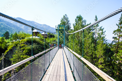 Fototapeta Naklejka Na Ścianę i Meble -  Altay Chemal beautiful hanging bridge across a mountain river Katun' Russia