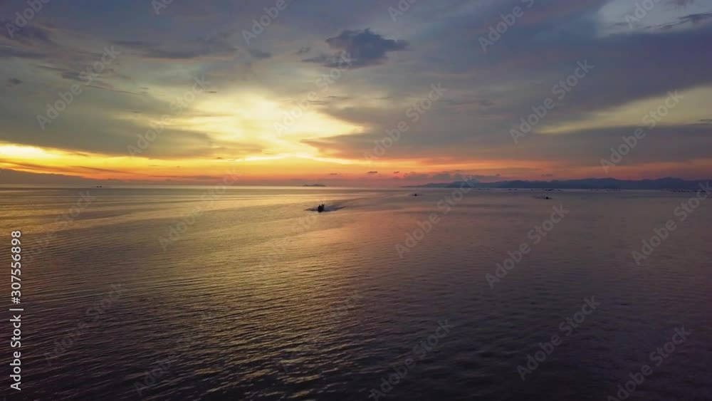 Aerial view boats going back from sea during beautiful sunset hour at Penang, Malaysia. Aerial view boats going back from sea during beautiful sunset hour at Penang, Malaysia.