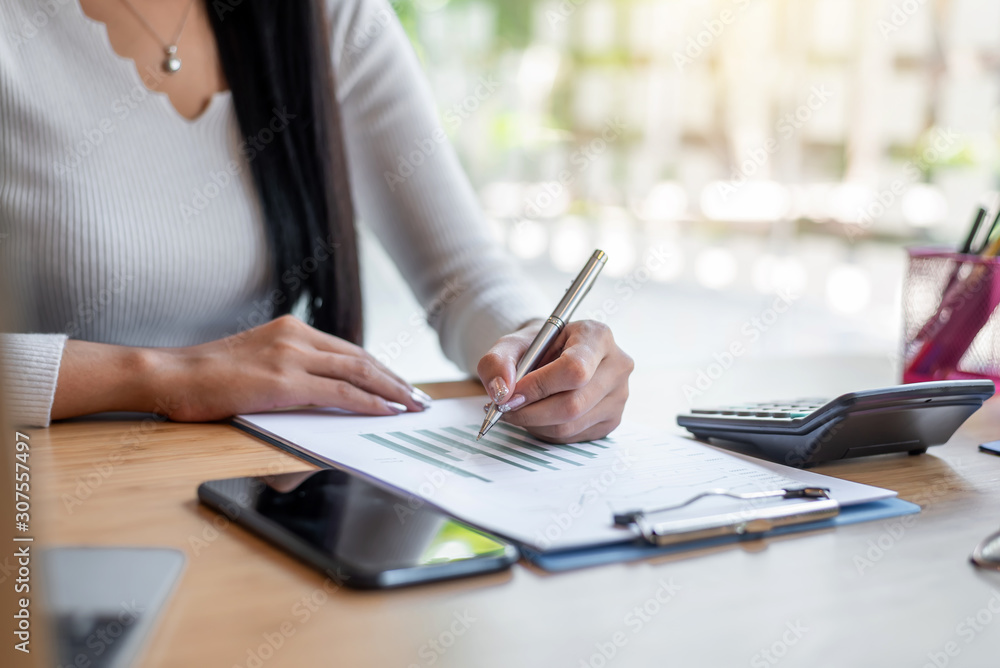 Business woman hand pointing to graph information. Business woman hand pointing to graph information.