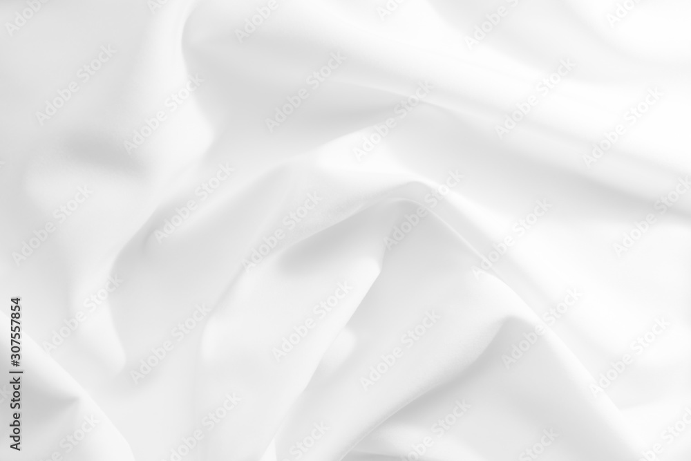 Abstract white fabric texture background. Cloth soft wave. Creases of satin, silk, and cotton. Abstract white fabric texture background. Cloth soft wave. Creases of satin, silk, and cotton.