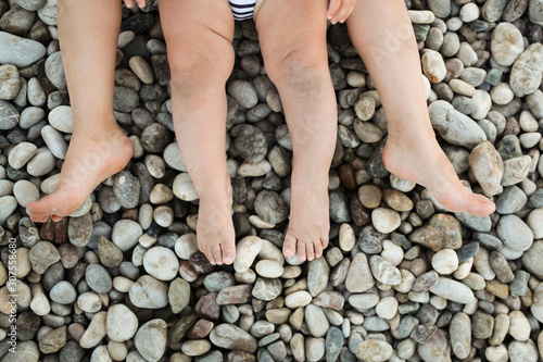 pebble beach in Turkey. Dusty legs with pebbles. © natalialeb