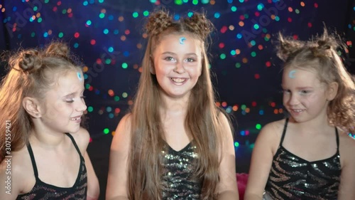 Three funny girlfriends having fun at a children's party.