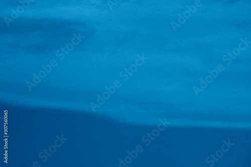 Catamaran boat sailing in turquoise water. View from above