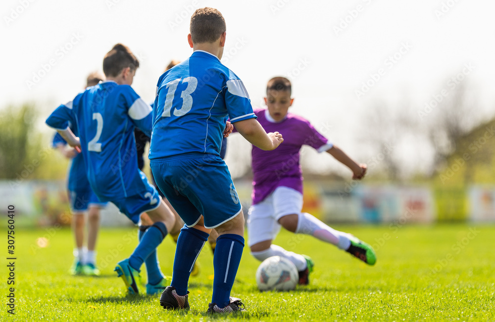 Kids soccer football - children players match on soccer field