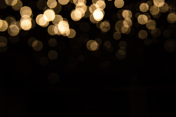 Abstract gold bokeh with black background