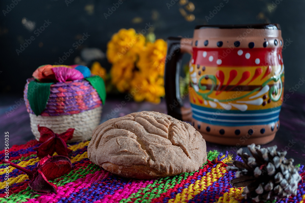 Fototapeta premium Concha Bread, Mexican Sweet Scone and Coffee Jar on Woven Tablecloth.