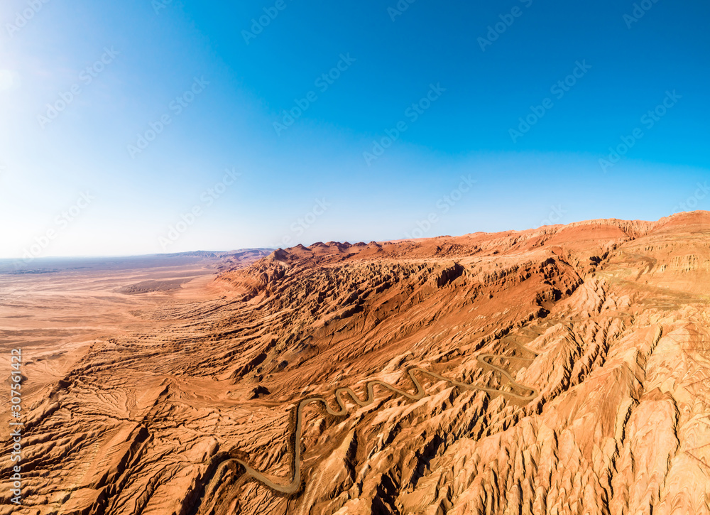 The Flaming Mountains are barren eroded red sandstone hills in Tian Shan Mountain range Xinjiang China.