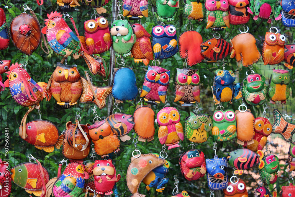 souvenirs from Portugal. Multi-colored trinkets. Owls, roosters, fish.