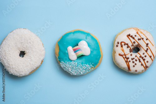 Flat lay of donut on blue background