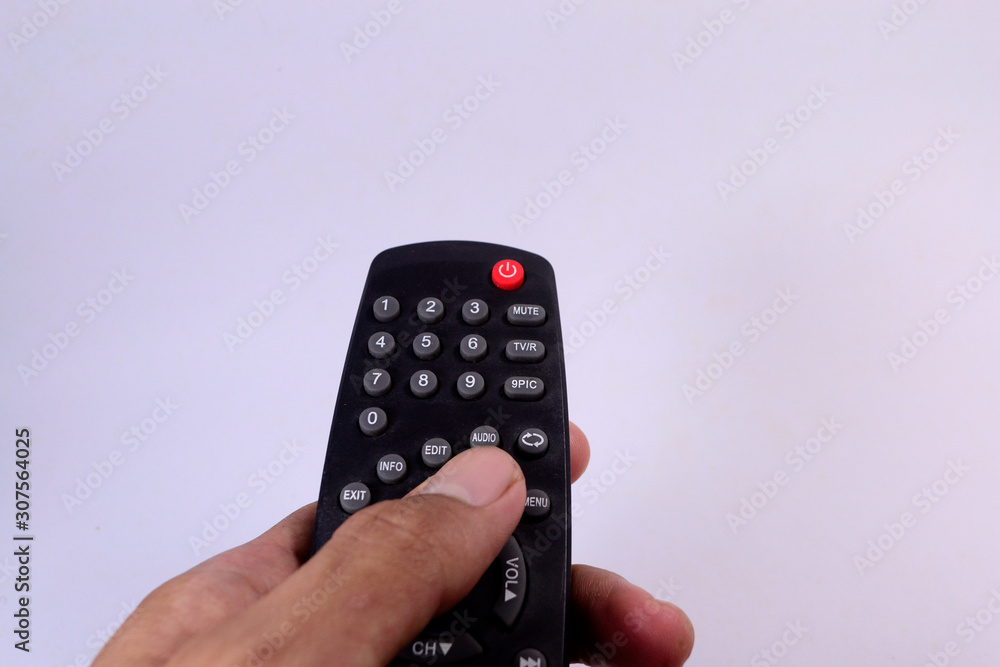 hand holding remote control isolated on white hand holding remote control isolated on white