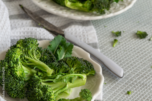 Preparing raw broccoli florets for cooking, cooking fresh vegetables, healthy ingredient, still life