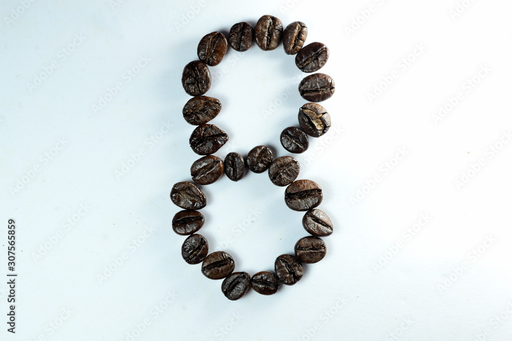 Coffee Been, the number eight is formed with coffee beans in white background Coffee Been, the number eight is formed with coffee beans in white background