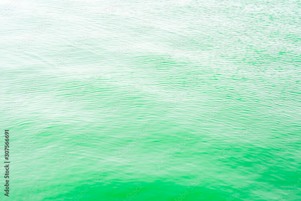 Bright green Tones Water Waves Surface as Background