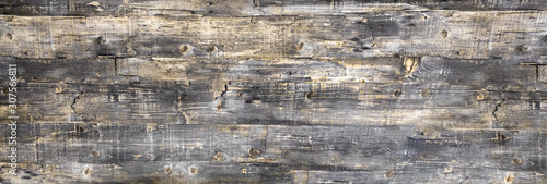 Shabby wood texture with old peeling paint. Vintage graffiti background, cracked wood texture. Clipart, beautiful cracks on the surface of the table or wall, boards.