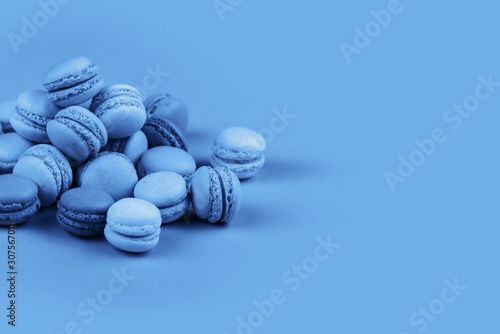 Group of Ultra Violet and blue macaronscorn on trendy blue background.