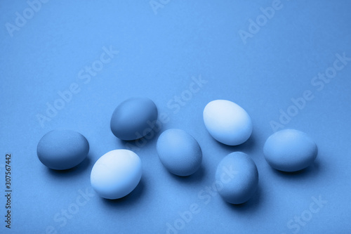 Group ombre blue Easter eggs on colorful background. close up